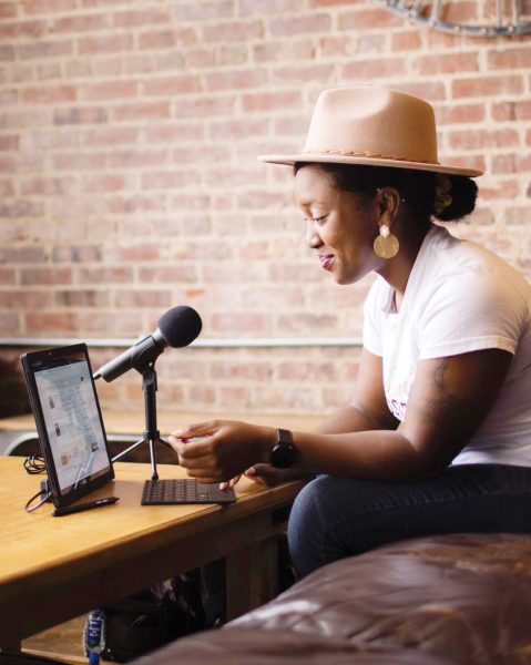 The entrepreneur works on her podcast.