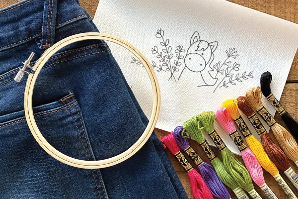The materials needed for this DIY hand embroidering project for jeans