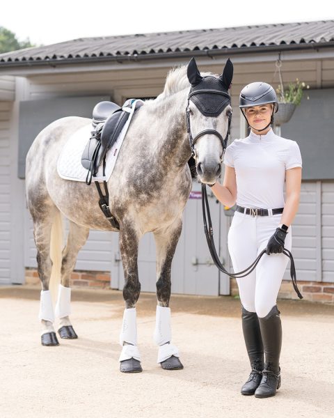 This Esme smiling with confidence at a horse show