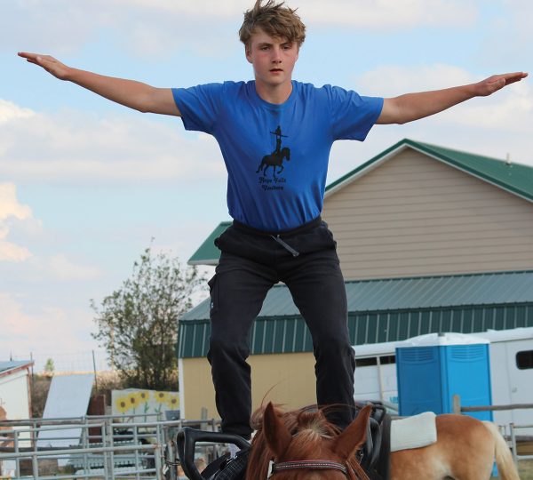 A young man holds a position that will help his knees absorb the shock