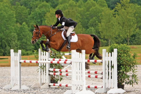 Kristen jumping at a show